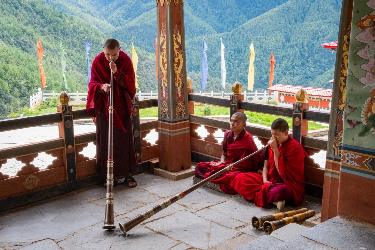 Monks play the dungchen during Tibetan Buddhist ceremonies.