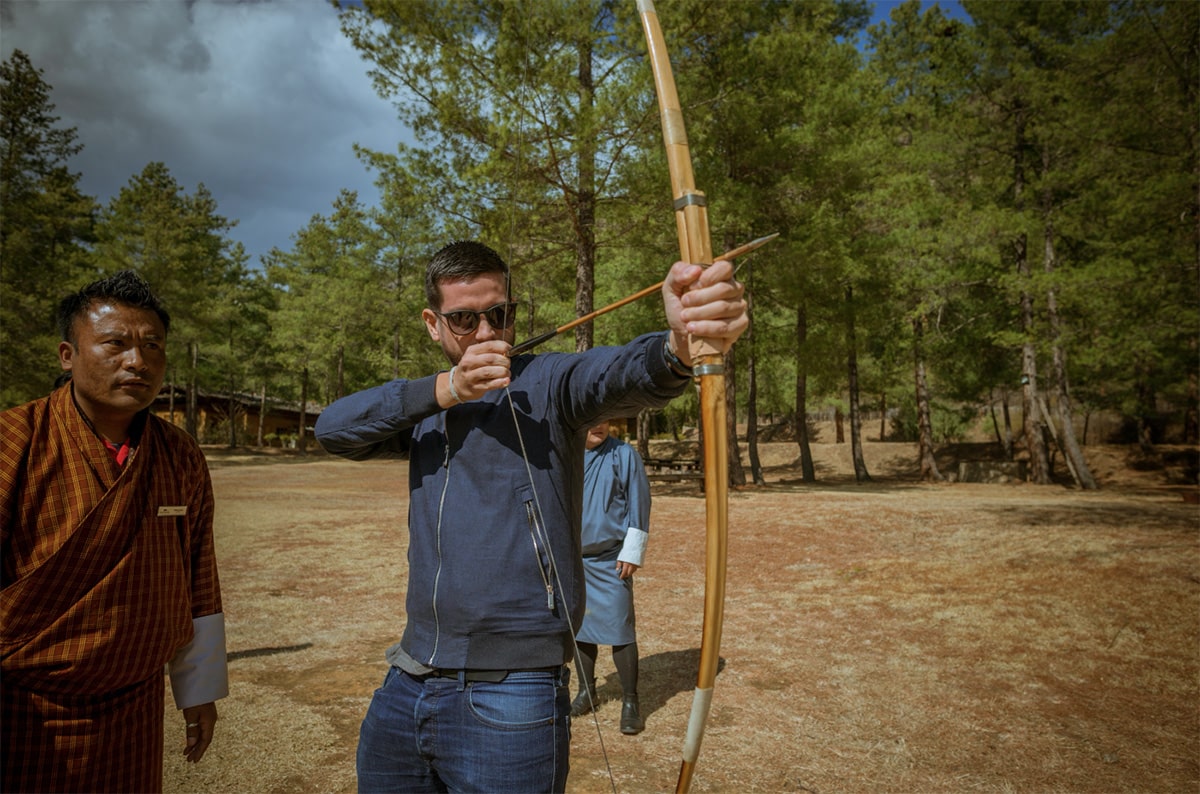 Team enjoying a friendly game of traditional Bhutanese archery, or khuru