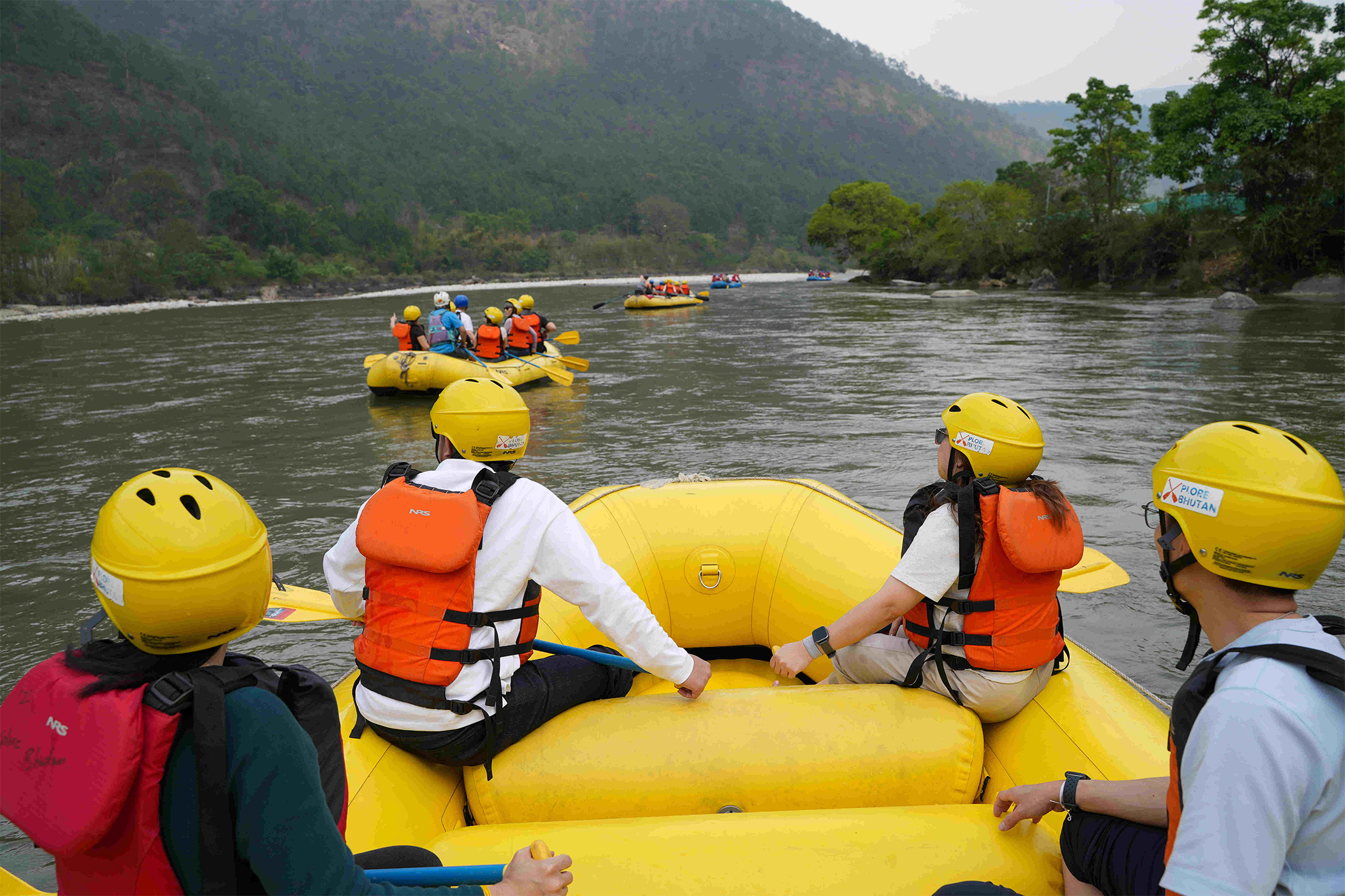 Corporate group doing whitewater rafting in Bhutan
