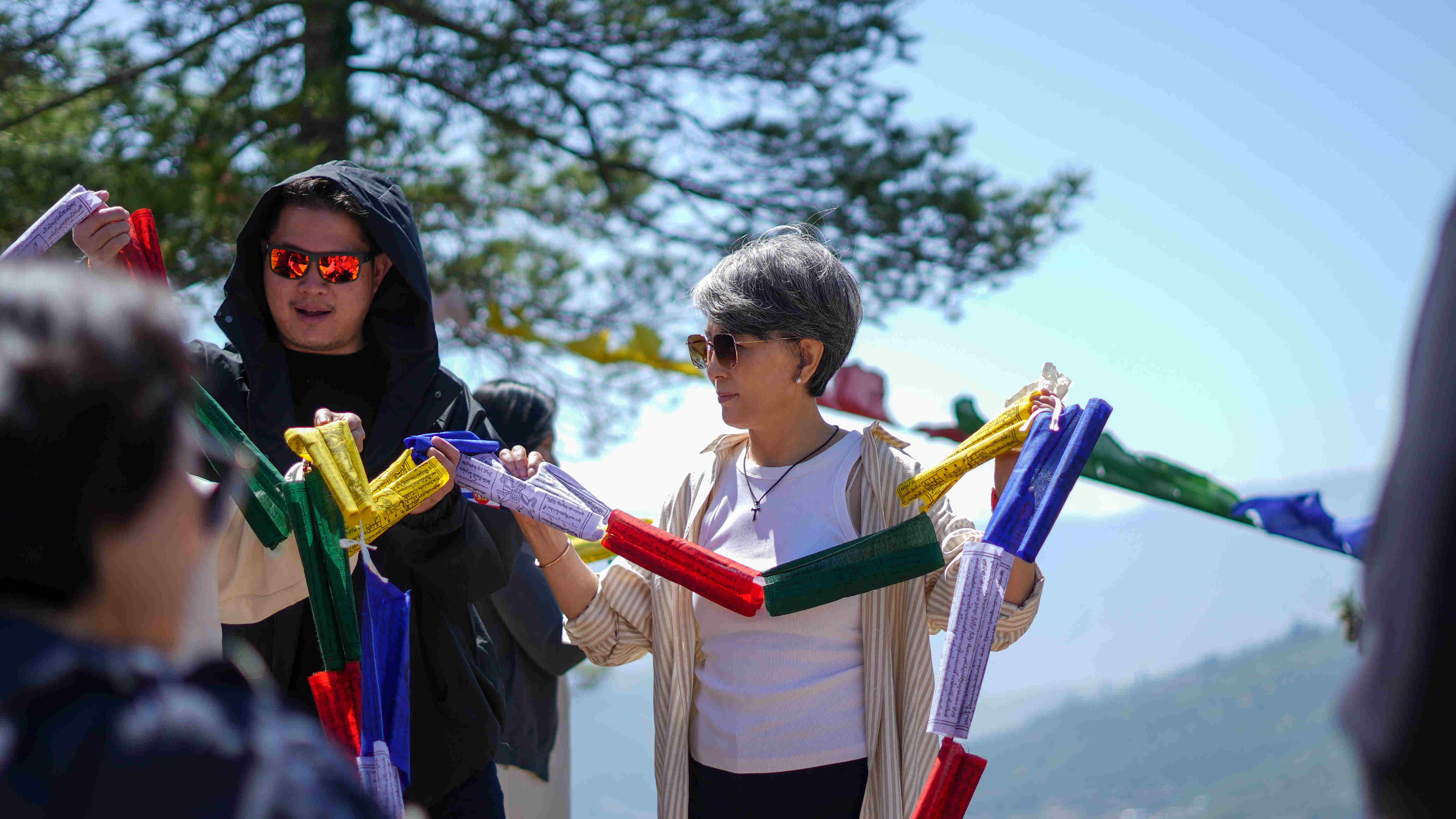tourists-hoisting-prayer-flags
