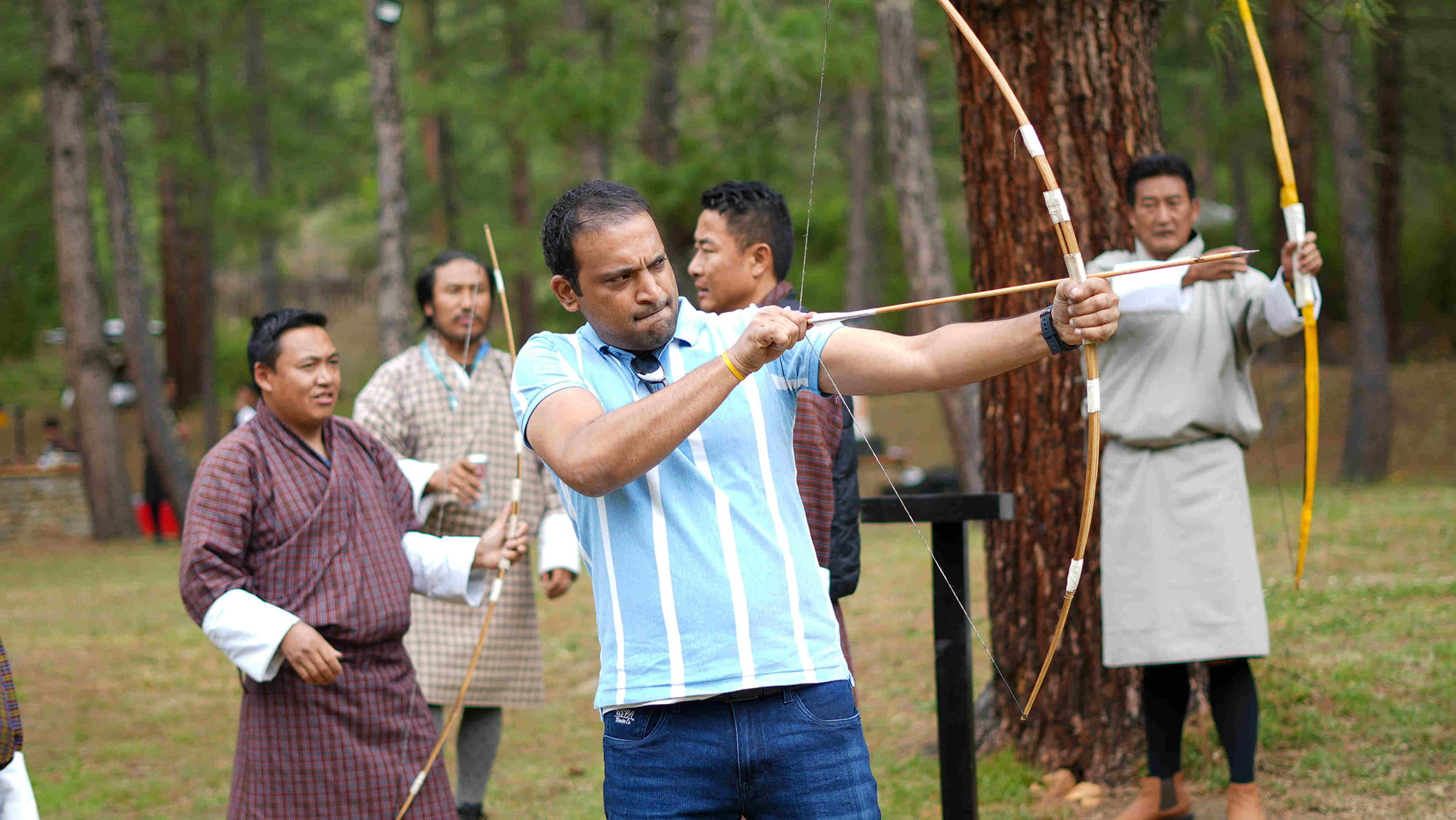 guest doing archery in Bhutan