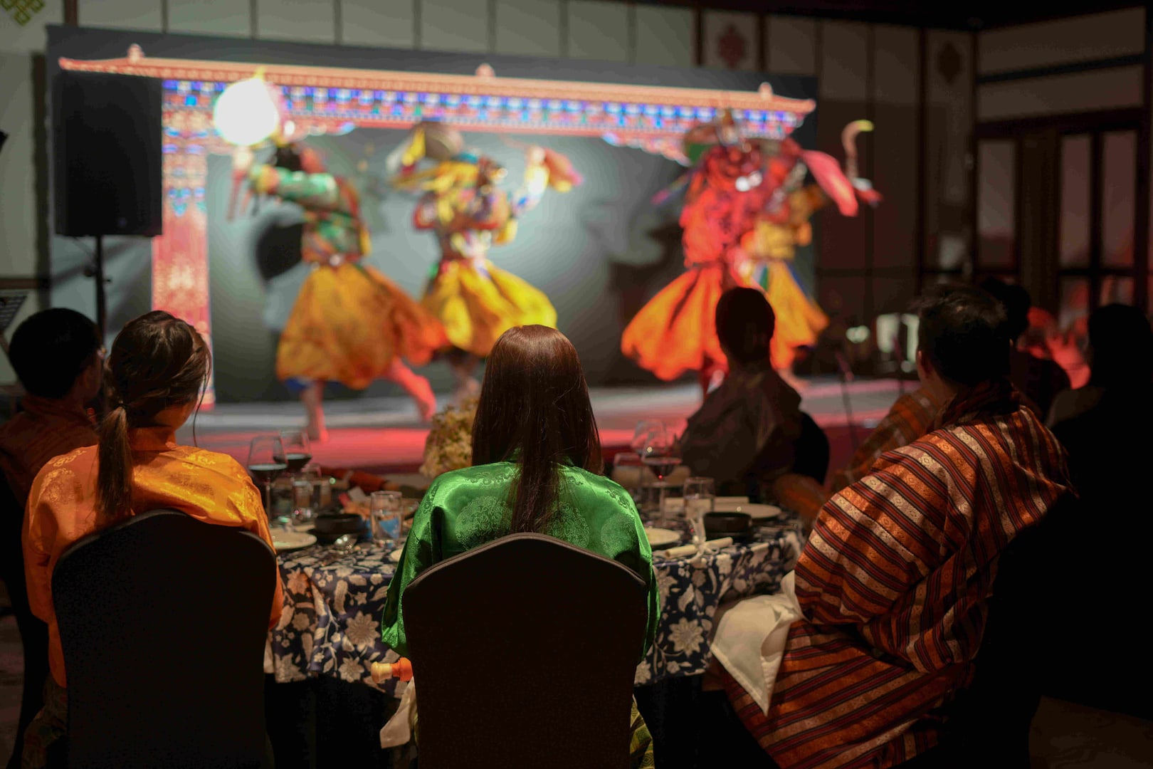 Meetingguests watching masked-dance performance corporate gala dinner bhutan